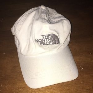 White North Face hat with silver stitching